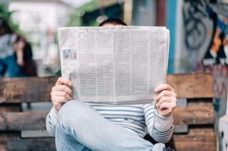 man reading newspaper